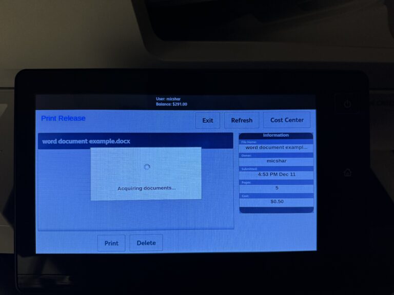 Printer screen showing a loading window captioned "Acquiring documents"